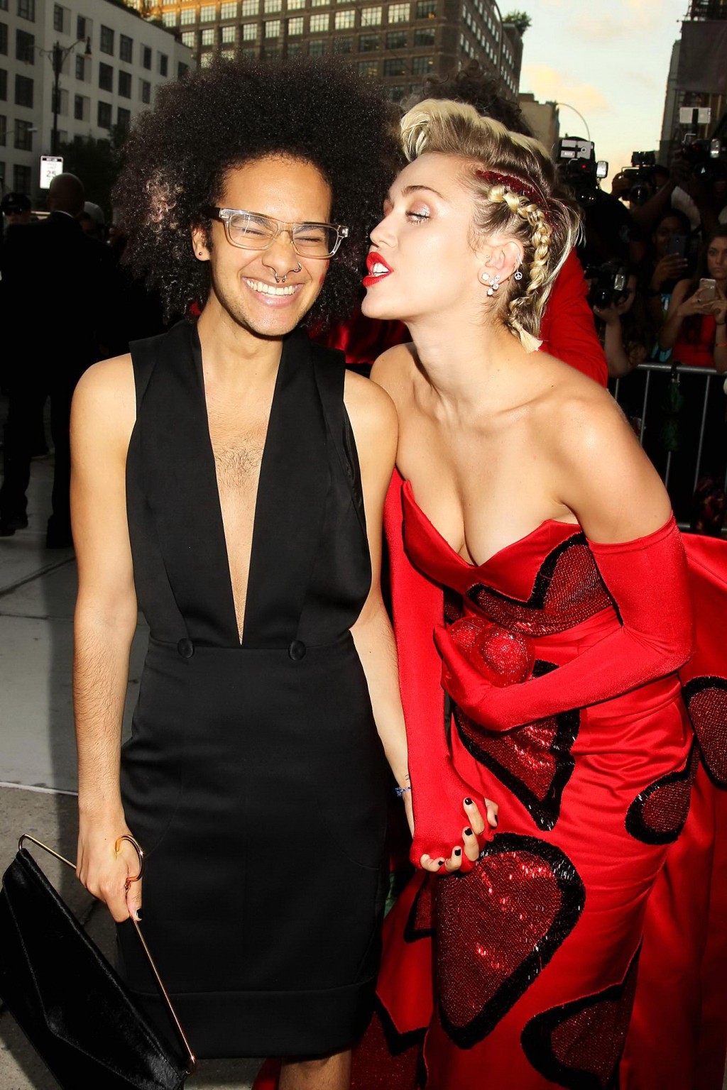 Miley Cyrus busty in a strapless red dress kissing a tranvestite #75160960