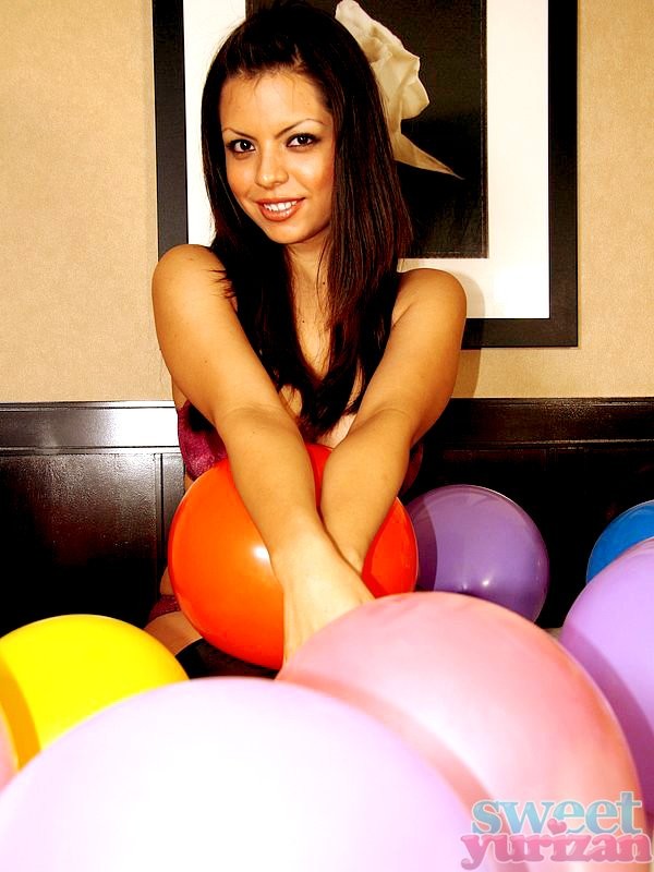 Yurizan Beltran playing with balloons #77975307