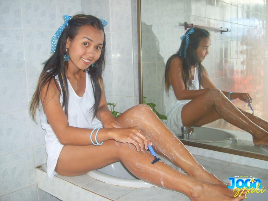 Thai teen girl shaving legs