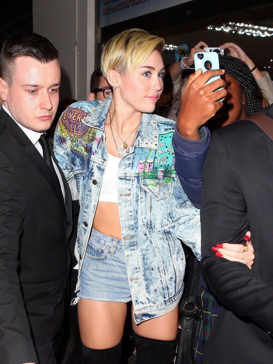 Miley Cyrus wearing denim hotpants  fuck-me boots out in London #75218648