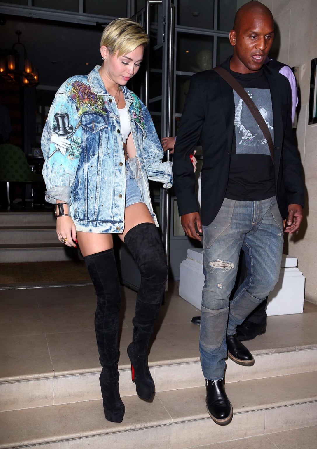 Miley Cyrus wearing denim hotpants  fuck-me boots out in London #75218697
