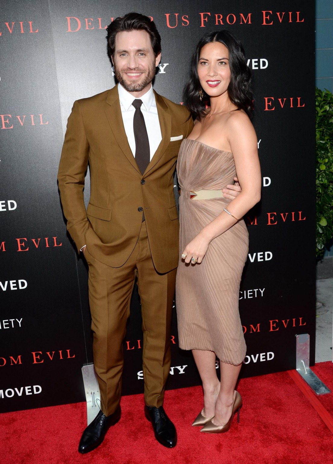 Olivia Munn busty wearing a strapless dress at Deliver Us From Evil screening in #75192929