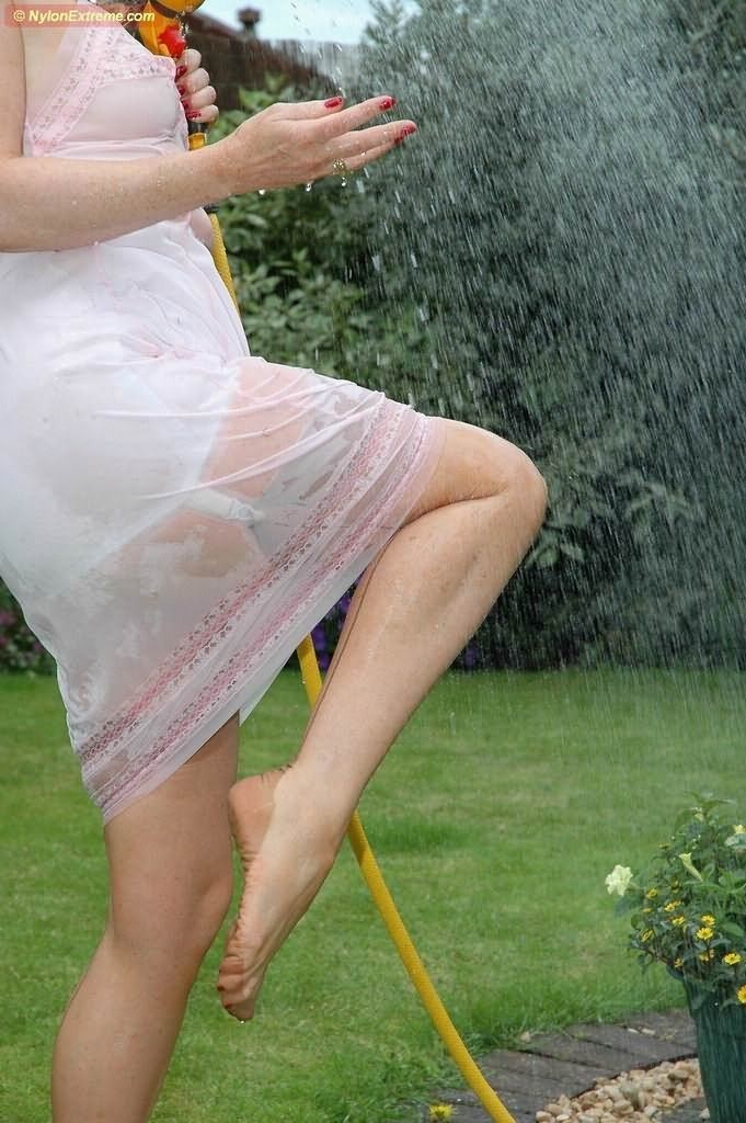 Nylon Sue getting wet #76480140