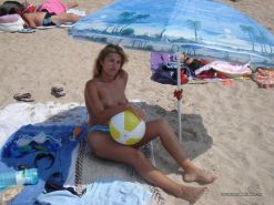 Amateur Blonde Wife Going Topless At The Beach