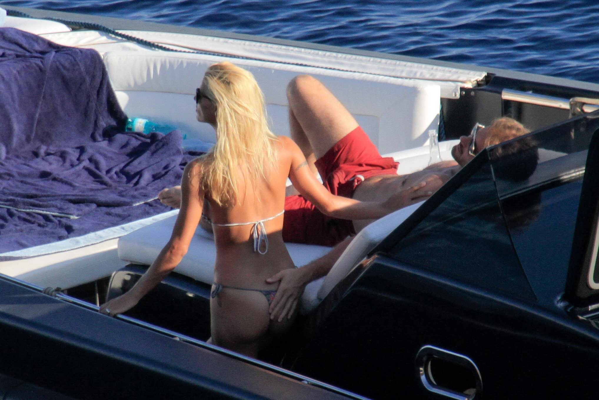 Michelle Hunziker wearing a thong bikini on a yacht in Elba