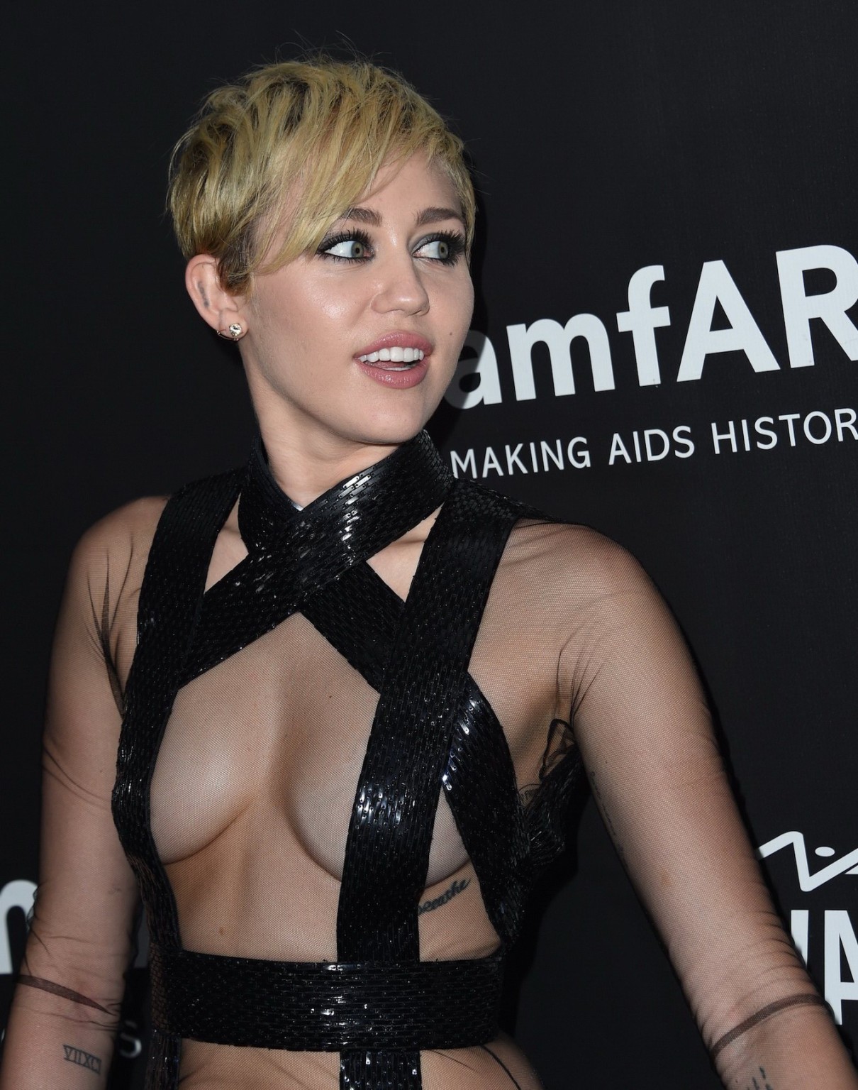 Miley Cyrus seethru covering only nipples at amfAR LA Inspiration 2014 Gala in H #75182755