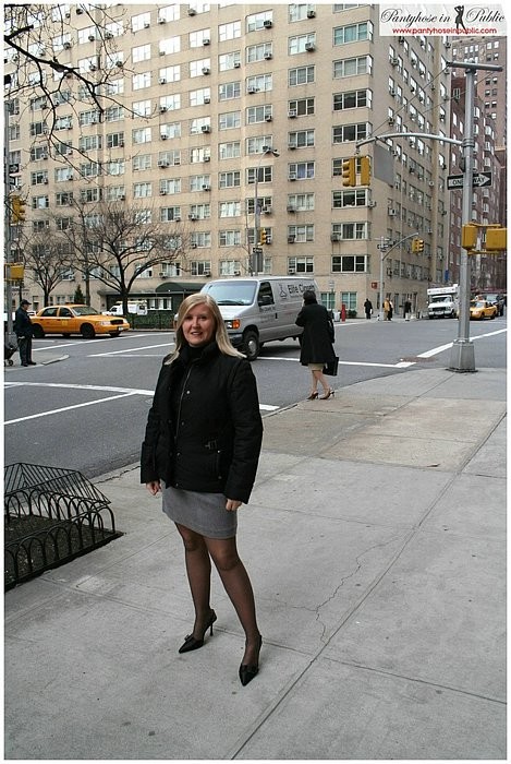 On the streets of New York in black pantyhose and high heels #73474912