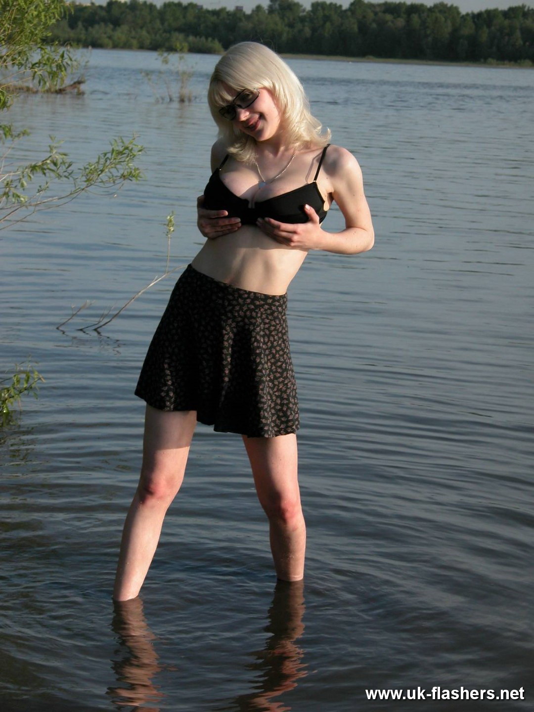 Blonde amateur flasher Coco showing tits by the river #67273565