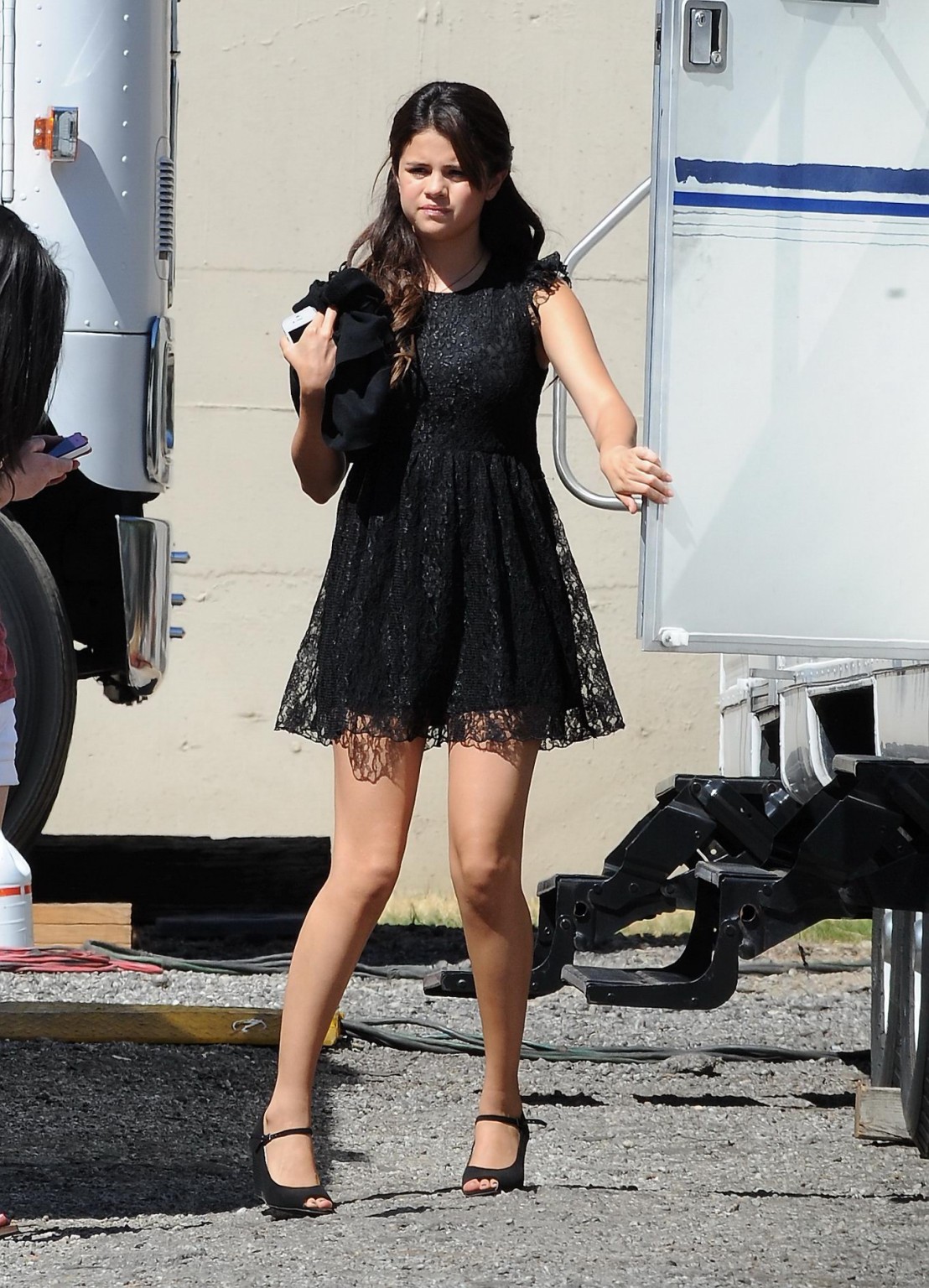 Selena Gomez leggy wearing a little black lace dress on 'Feed the Dog' set in LA #75253956