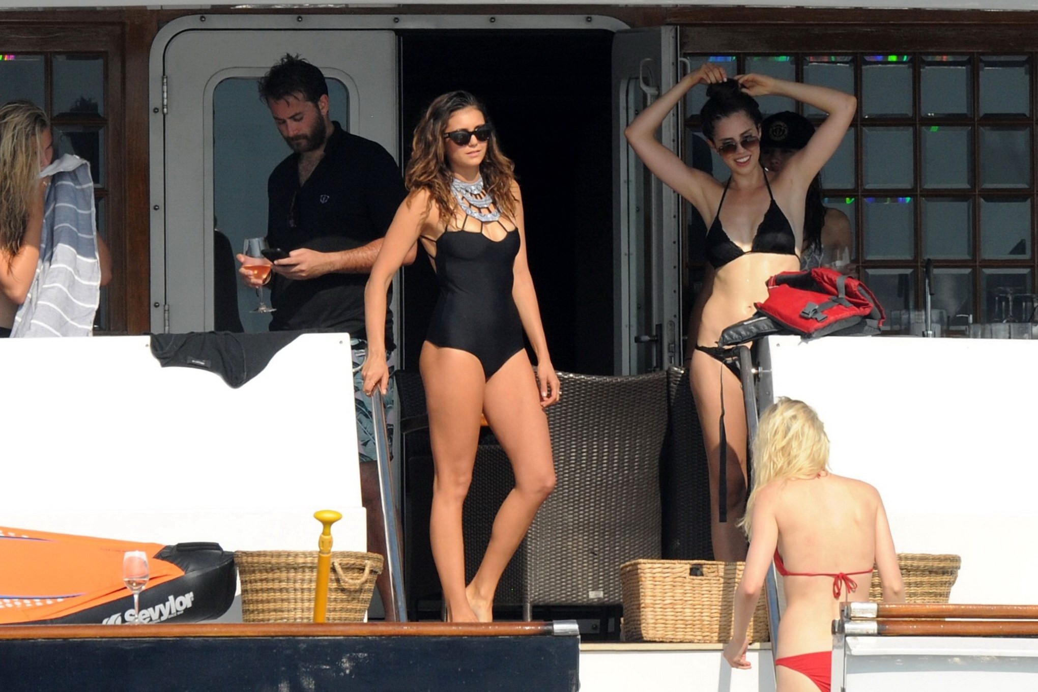 Nina Dobrev wearing a sexy black swimsuit on a yacht in St Tropez #75157779