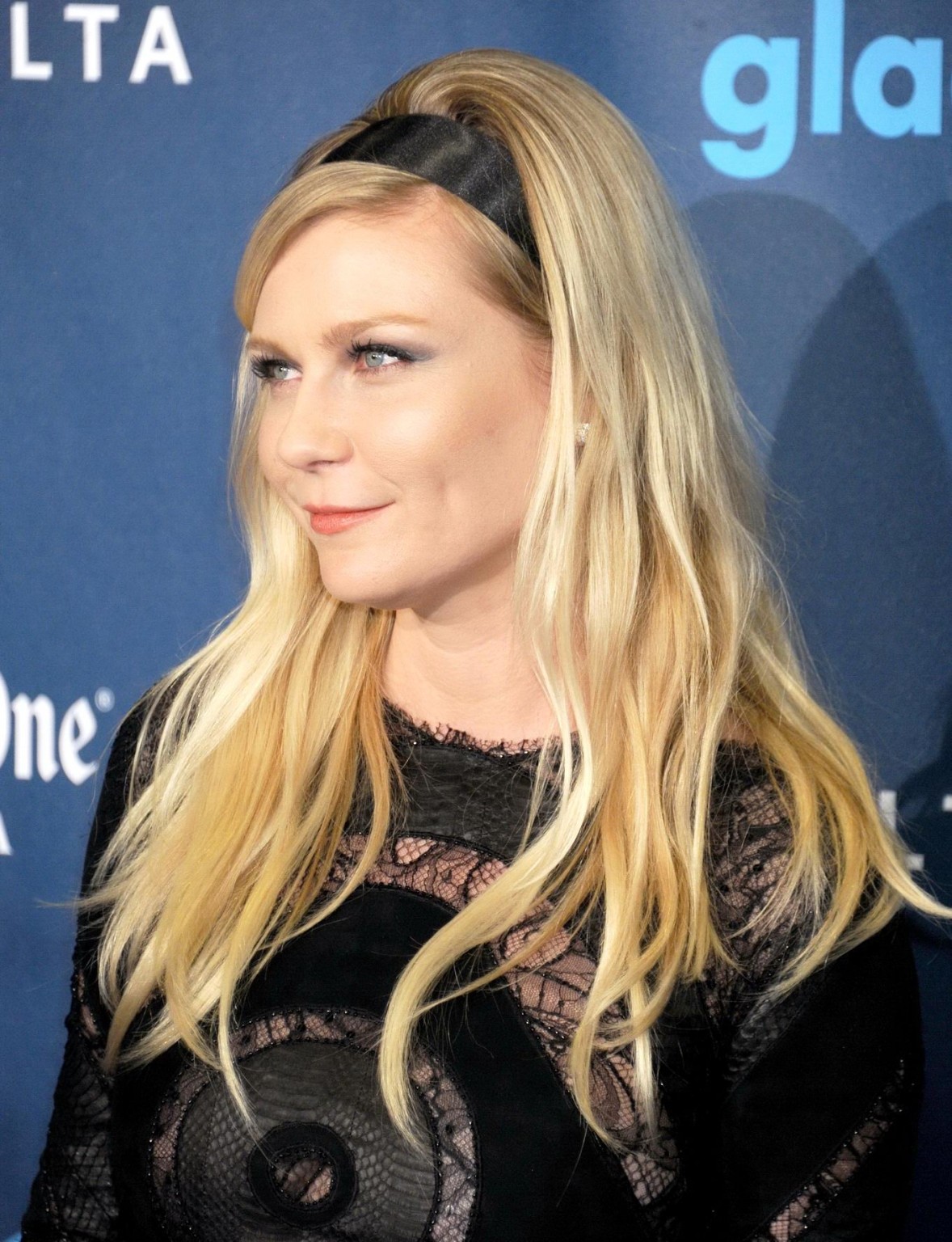 Kirsten Dunst wearing a partially see through little dress at the 24th Annual GL