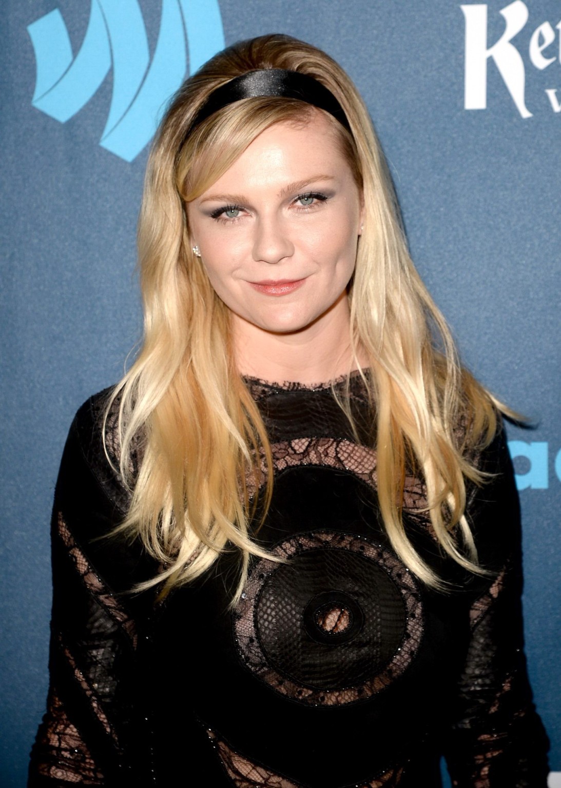 Kirsten Dunst wearing a partially see through little dress at the 24th Annual GL #75233647