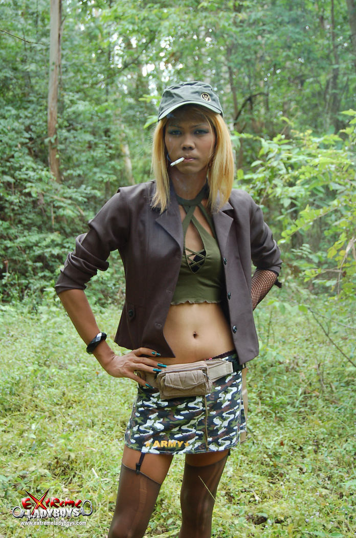 Ladyboy warrior in the forest #77929030