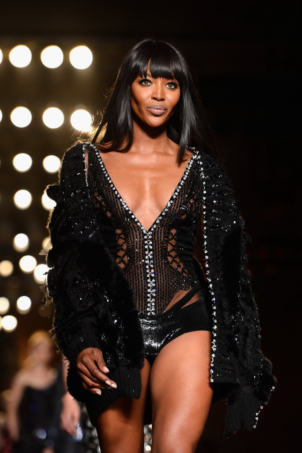 Naomi Campbell wearing black transparent lingerie on a catwalk during Versace sh #75226383