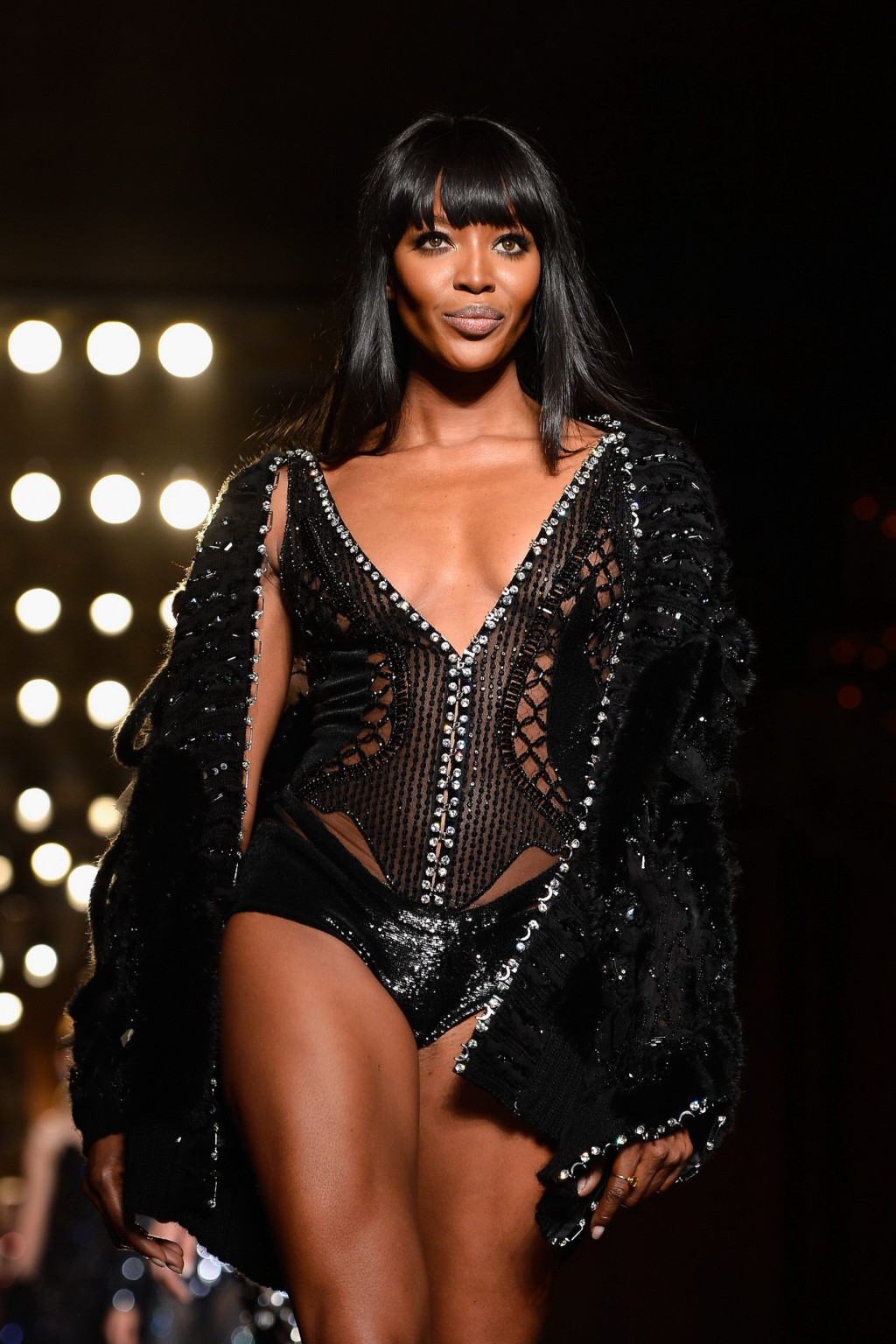 Naomi Campbell wearing black transparent lingerie on a catwalk during Versace sh #75226399
