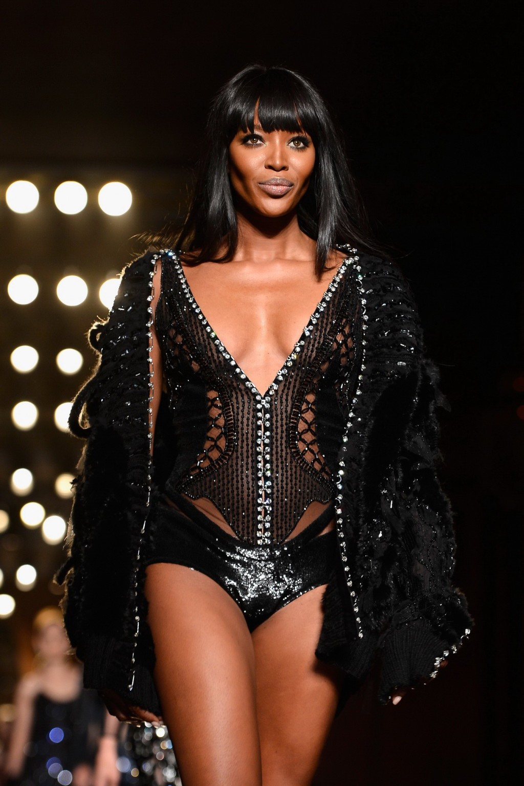 Naomi Campbell wearing black transparent lingerie on a catwalk during Versace sh #75226406