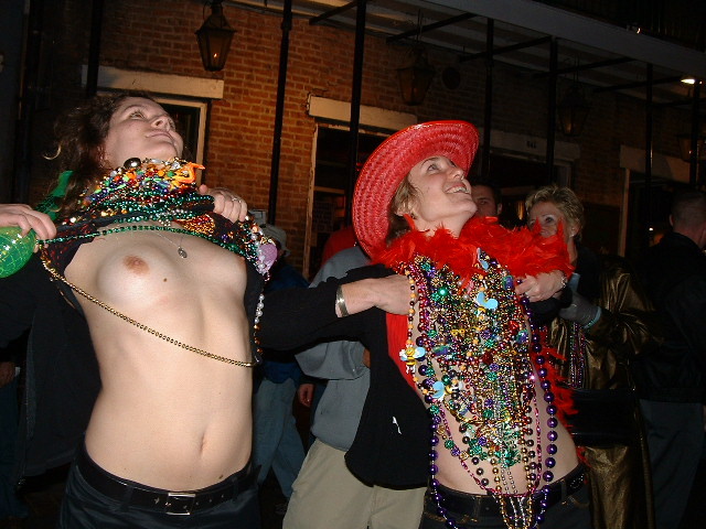 Drunk girls show boobs at mardis gras #76403251