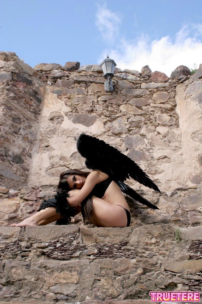 Teen girl in angel wings outside #74867911