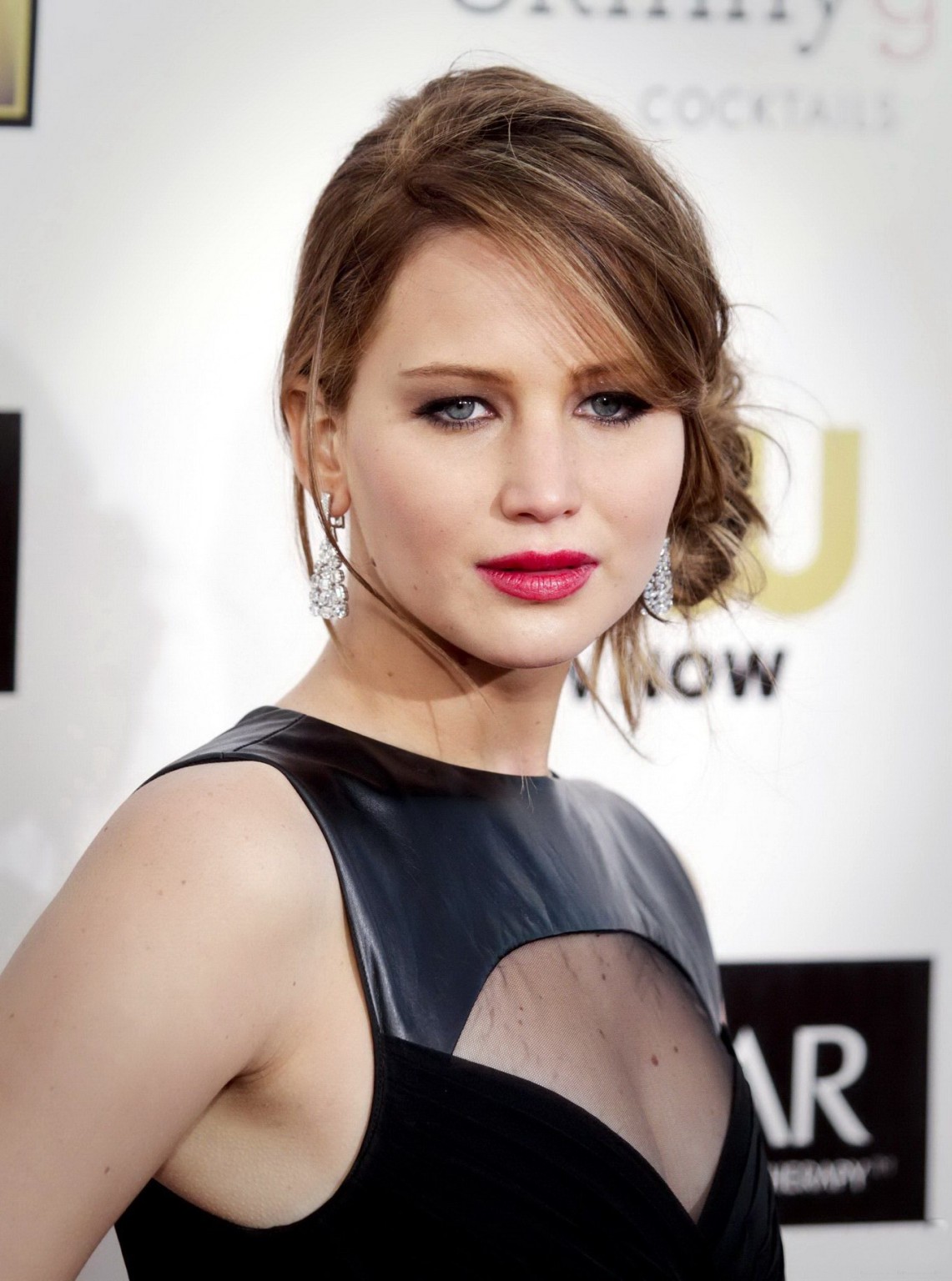 Jennifer Lawrence shows some cleavage wearing a black dress at 18th Annual Criti #75243871