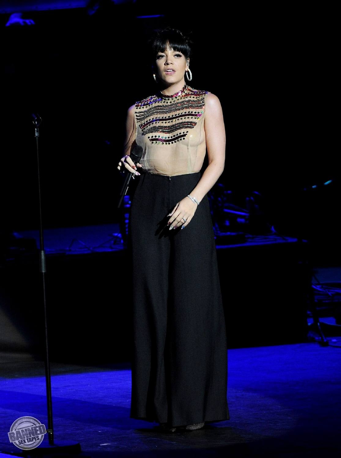Lily Allen  see her nude tits through transparent top during concert