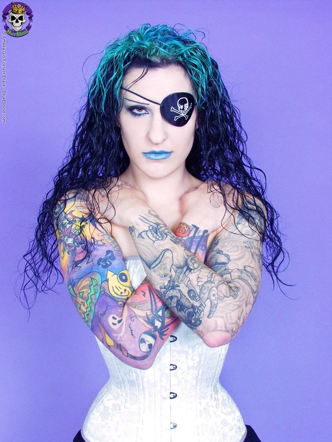 Gothic tattooed pirate girl along with her eyepatch