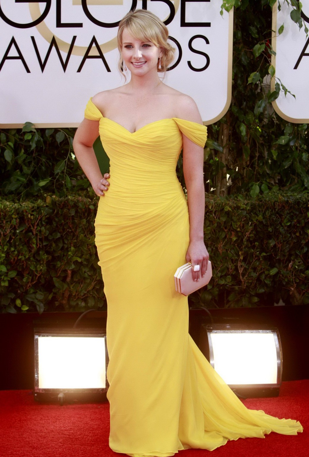 Busty Melissa Rauch wearing a yellow low cut dress at the 71st Annual Golden Glo #75207458