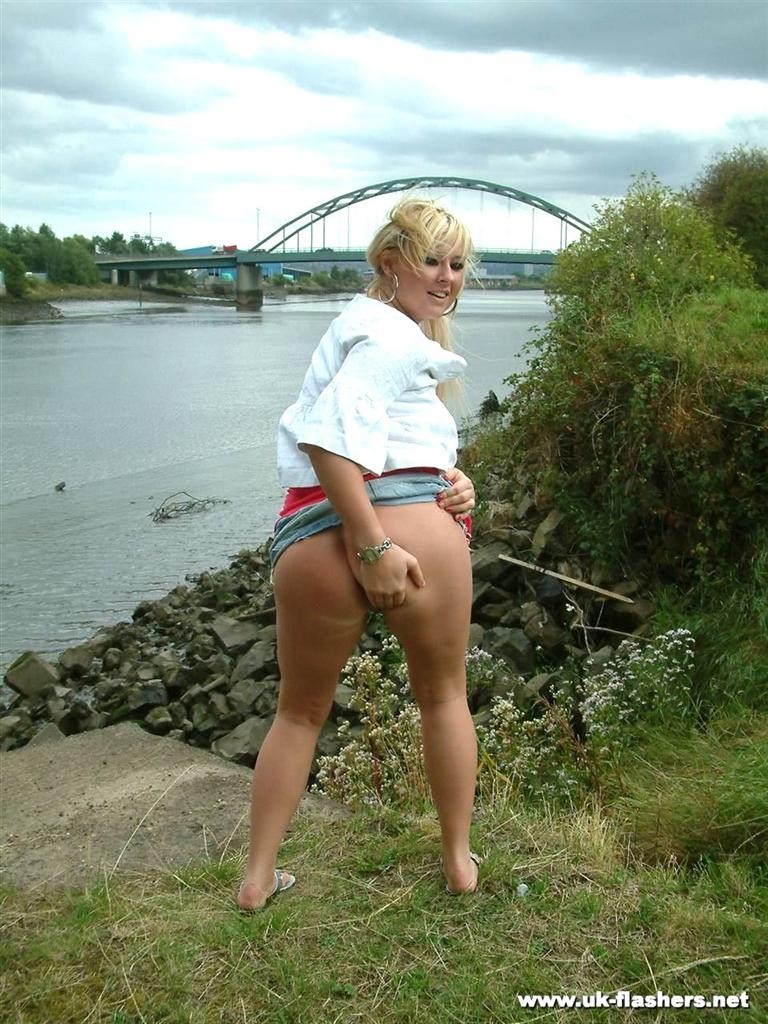 Cute amateur blonde exhibitionist flashing her tits by the river #78625833