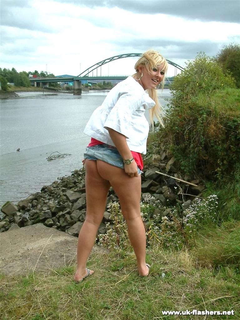 Cute amateur blonde exhibitionist flashing her tits by the river #78625837