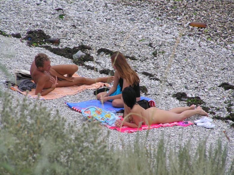 Friendly young Russian nudists lay on the beach #72254686