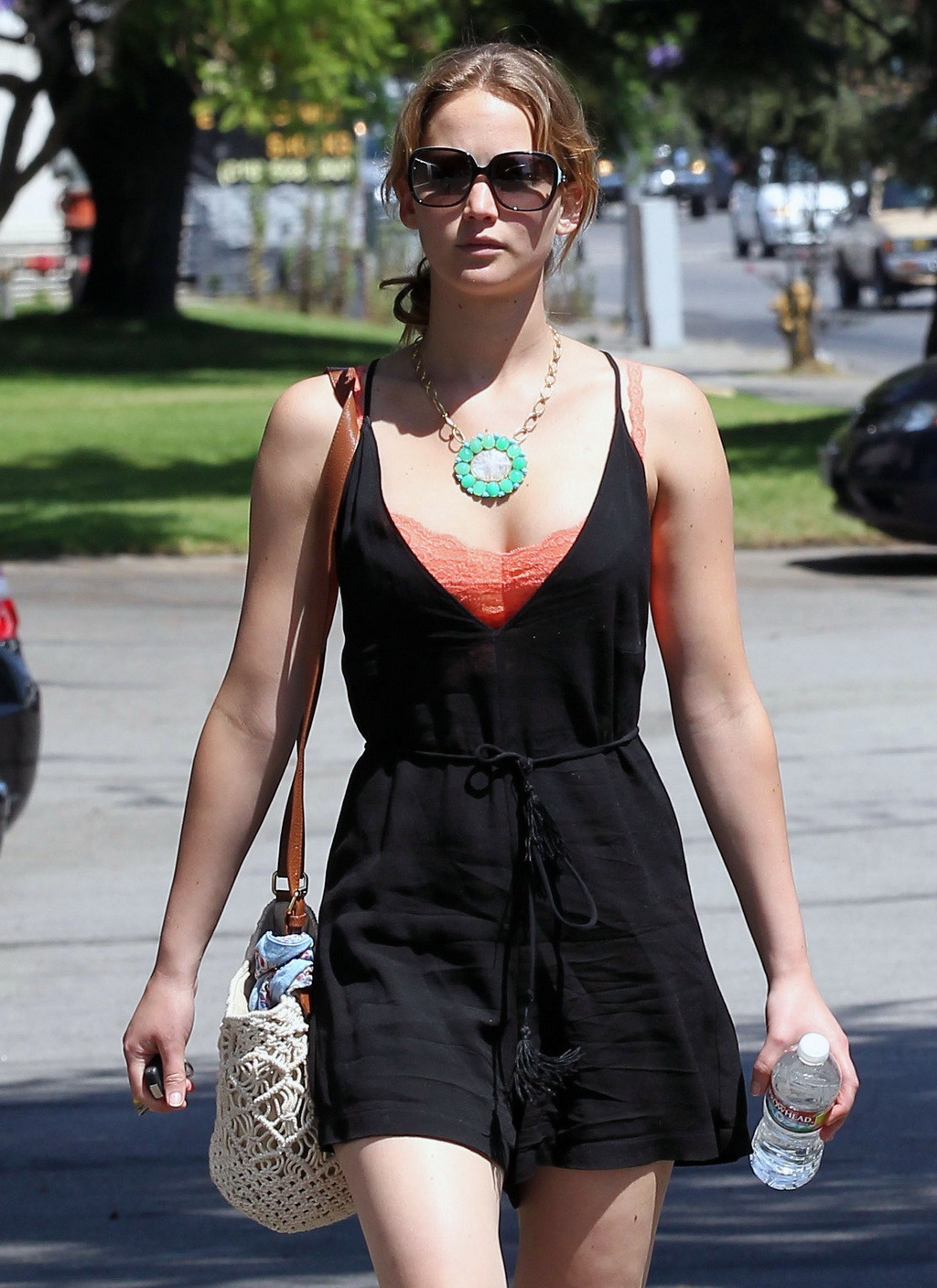 Jennifer Lawrence leggy and showing big cleavage in black low cut mini dress whi #75254948