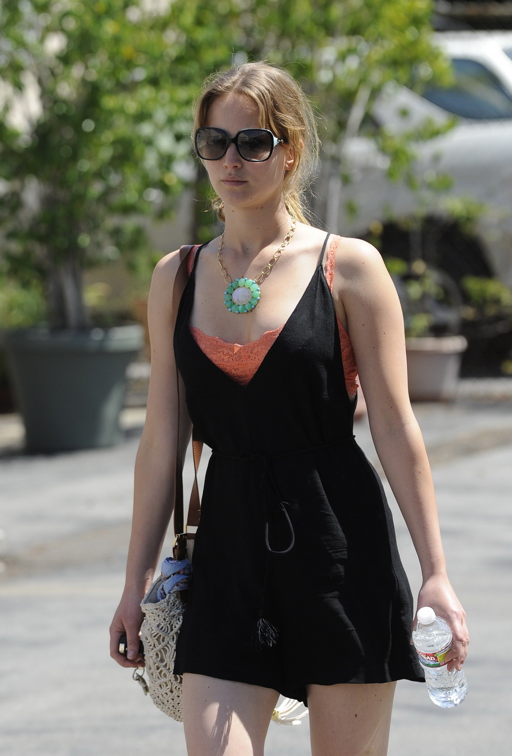 Jennifer Lawrence leggy and showing big cleavage in black low cut mini dress whi #75254956