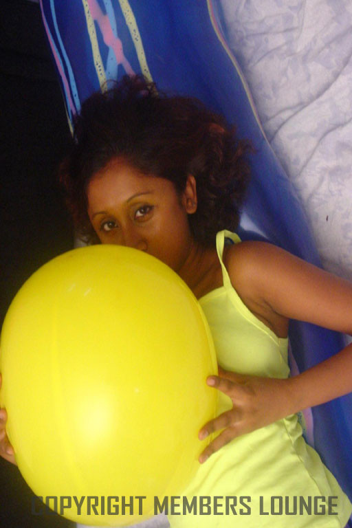Lovely Indian girl plays with balloons