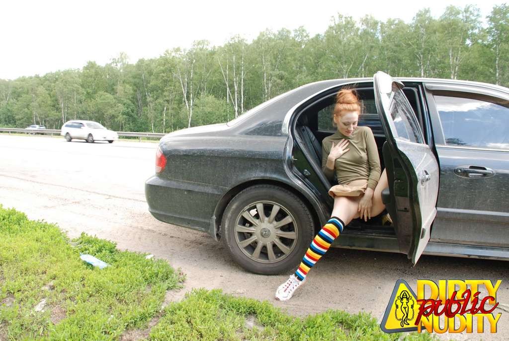 Milena pissing right from her car
 #67133045