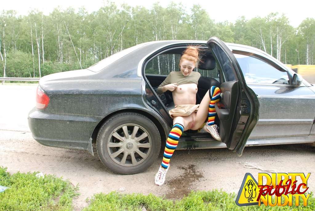 Milena pissing right from her car
 #67133158