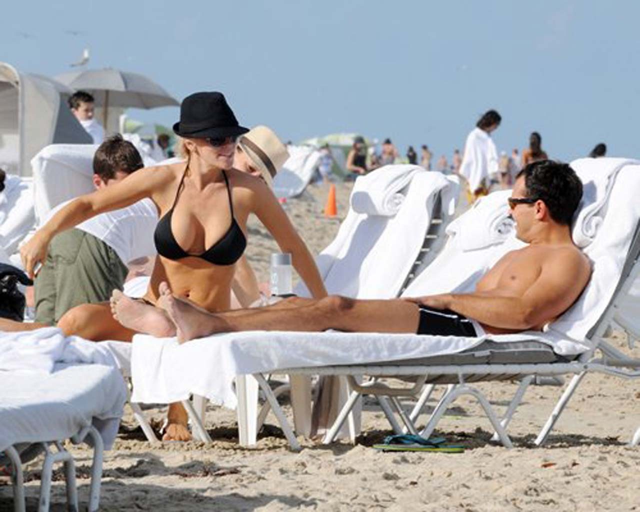 Jenny McCarthy exposing her sexy body and huge boobs in black bikini on beach #75313405