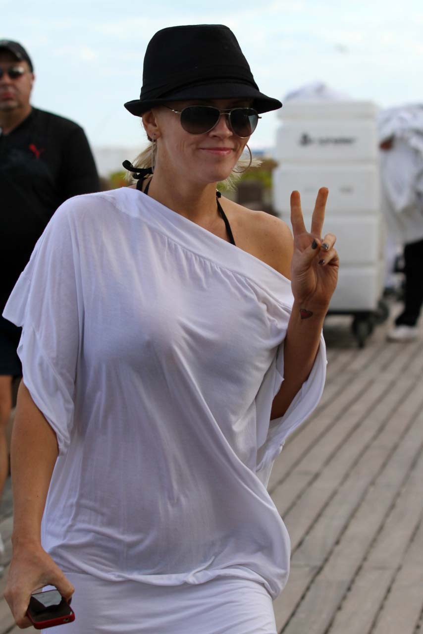 Jenny McCarthy exposing her sexy body and huge boobs in black bikini on beach #75313417