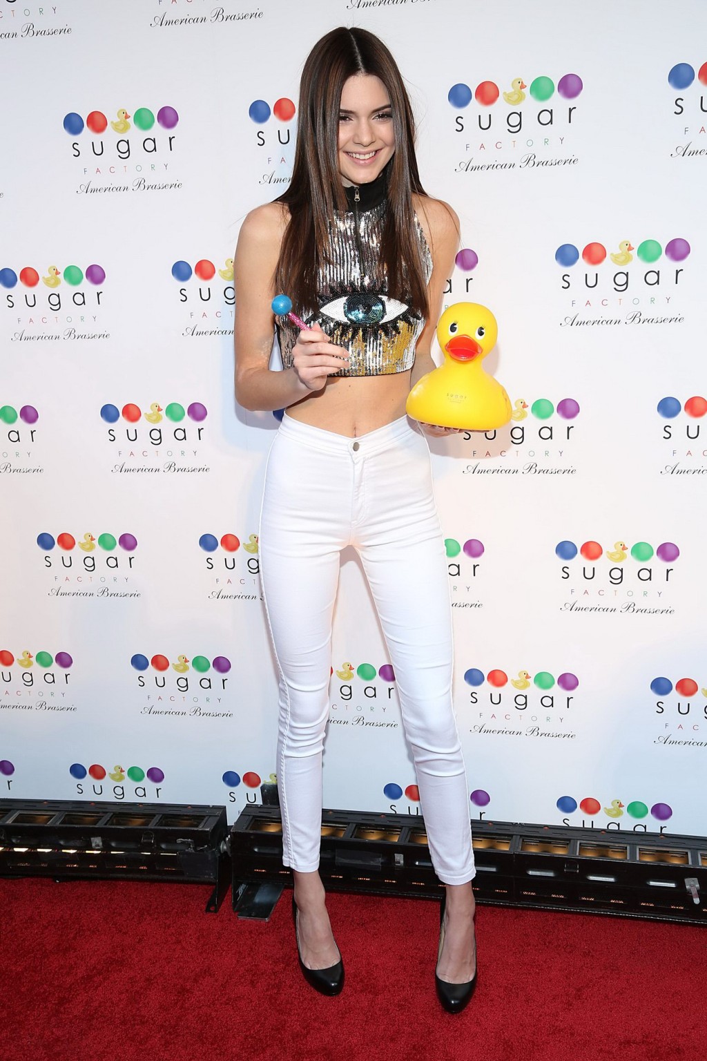 Kendall Jenner wearing tight belly top and white pants at the Sugar Factory gran #75228230