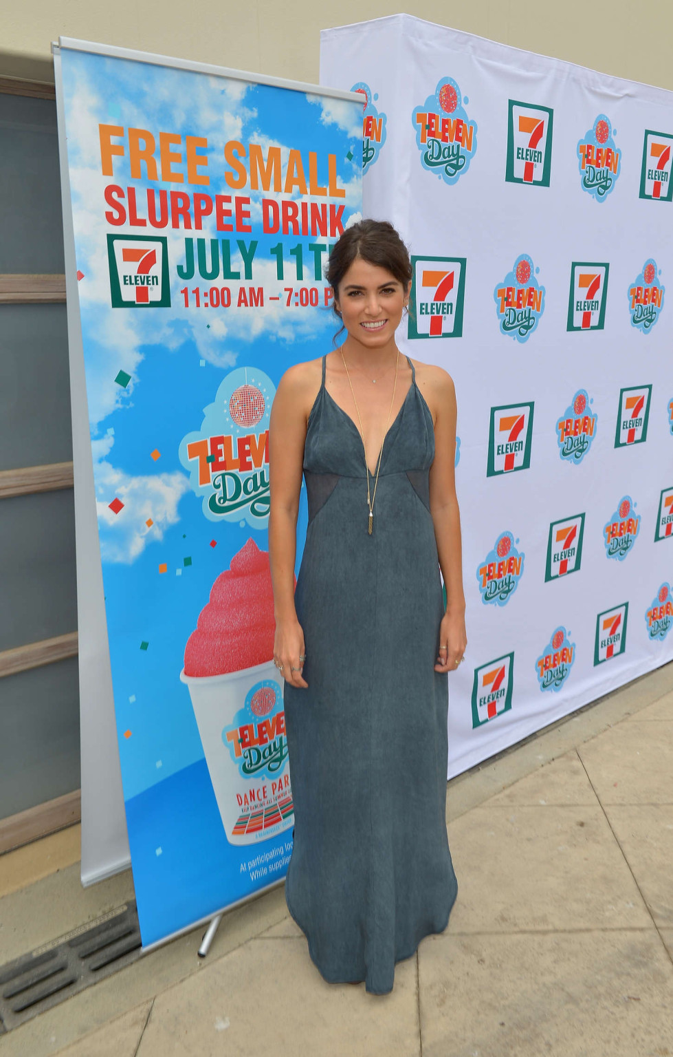 Nikki Reed braless showing huge cleavage in a low cut gray maxi dress at 7-Eleve #75224923