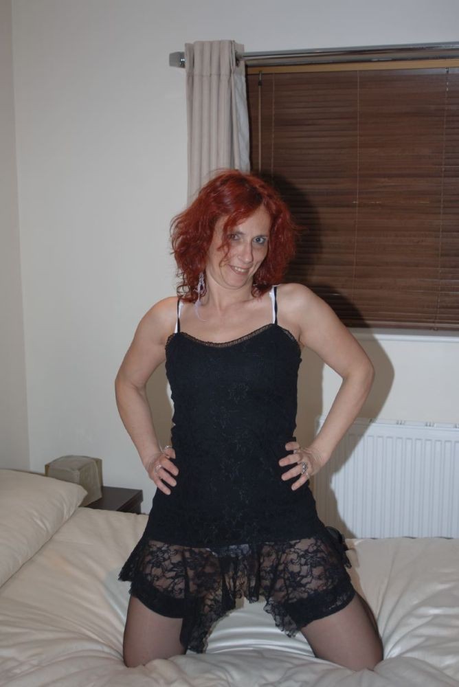 Redhead Wife In Black Stockings And Panties Spreading Pussy