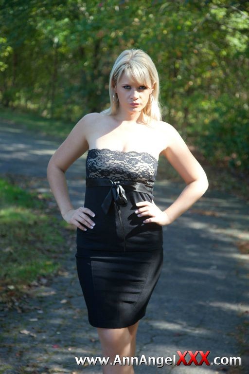 Sexy blonde outdoors in her black dress #72613048