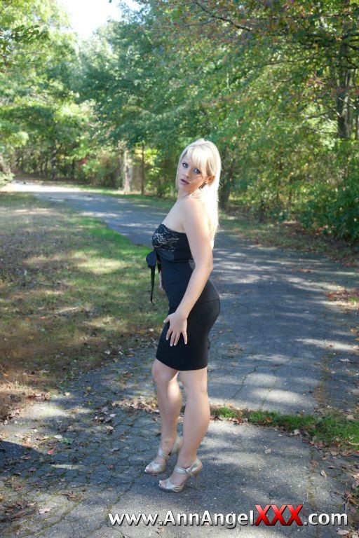 Sexy blonde outdoors in her black dress #72613085