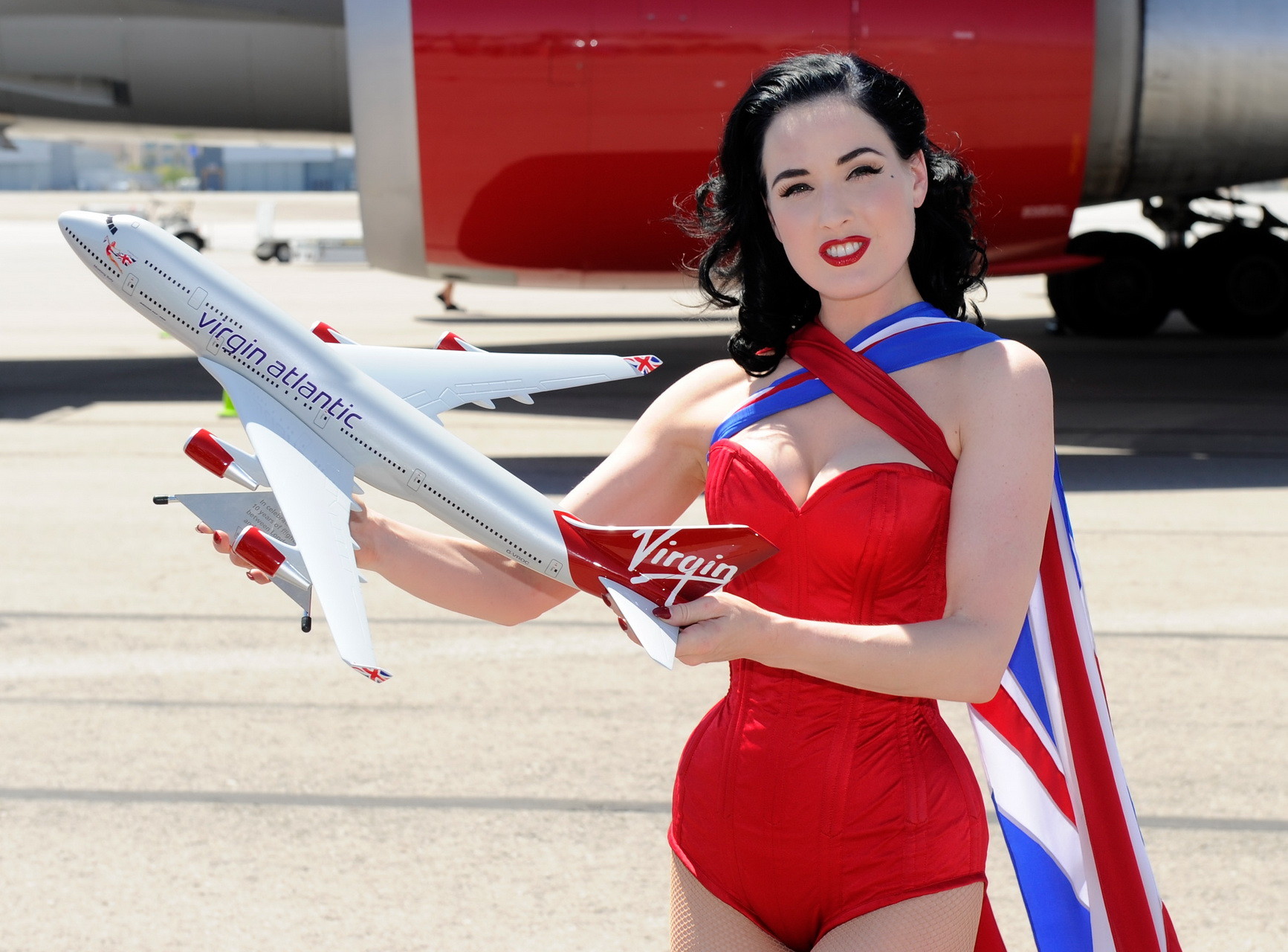 Dita Von Teese wearing red corset  fishnets at Virgin Atlantic's celebration #75344879