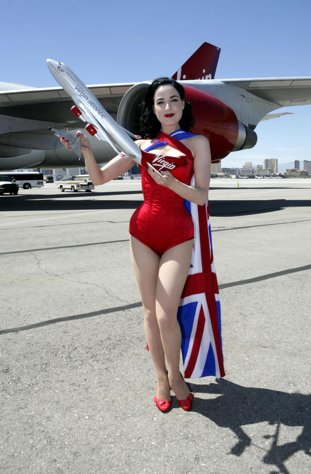 Dita Von Teese wearing red corset  fishnets at Virgin Atlantic's celebration #75344884