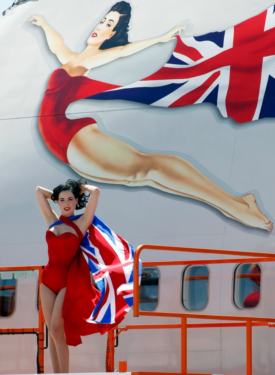 Dita Von Teese wearing red corset  fishnets at Virgin Atlantic's celebration #75344894