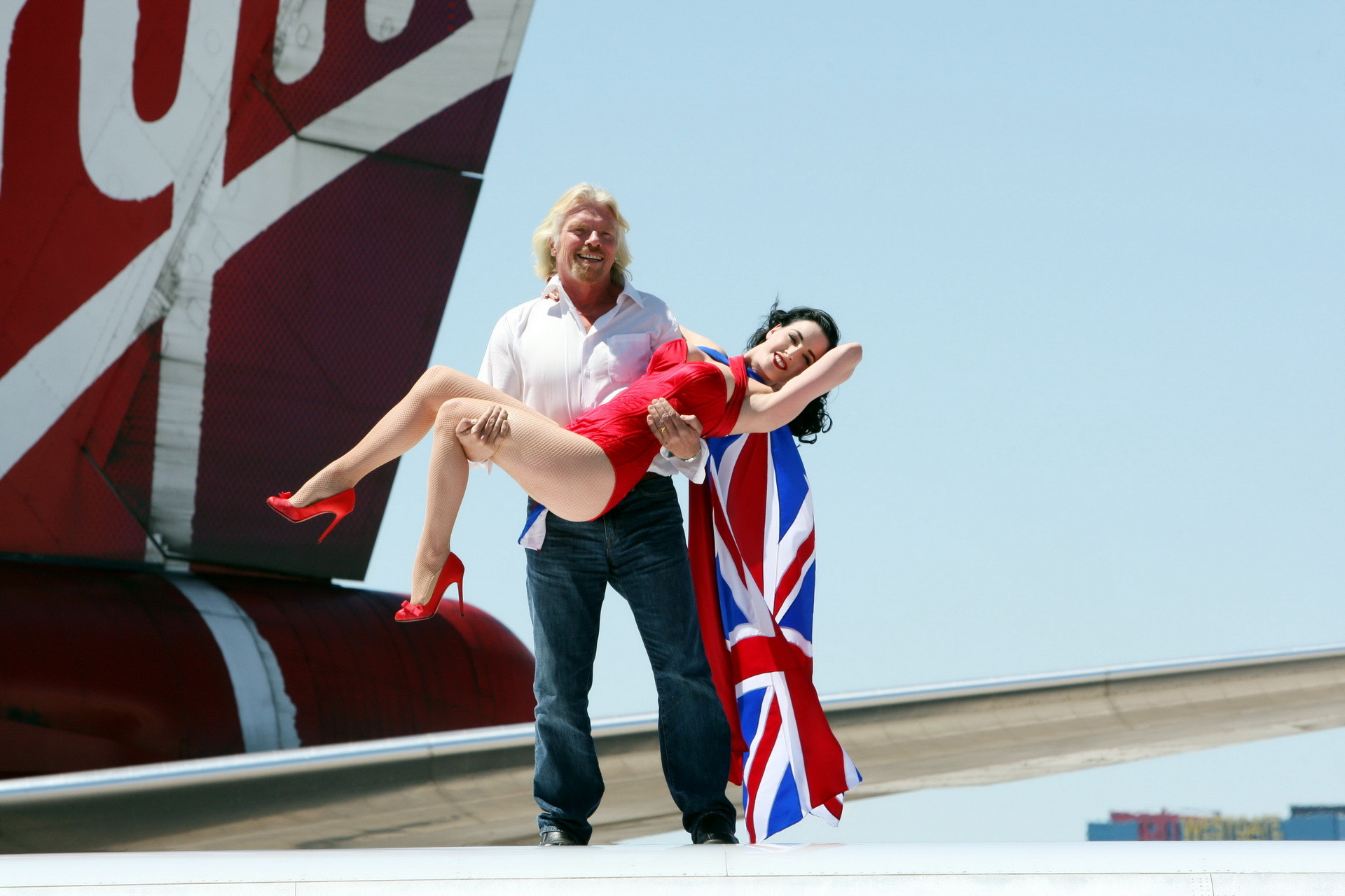 Dita Von Teese wearing red corset  fishnets at Virgin Atlantic's celebration #75344937