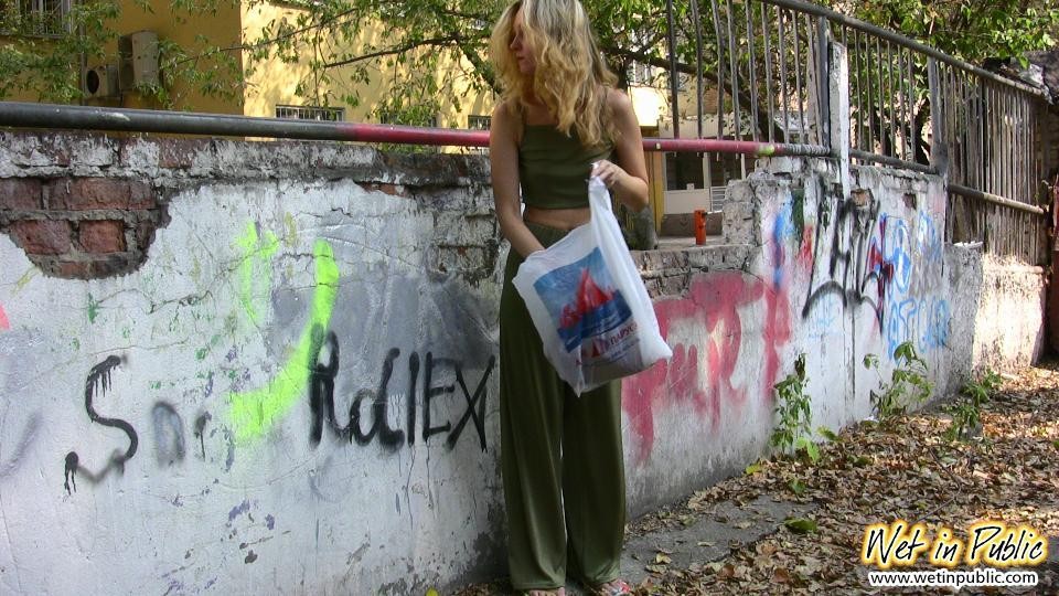 Blonde slim slut in green does a lil job right in the pants in public #73241188