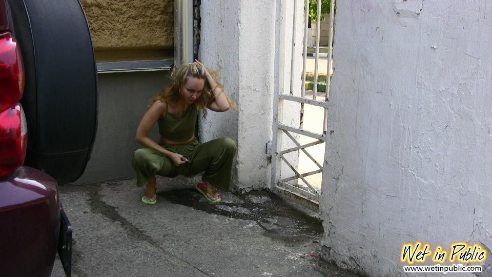 Blonde slim slut in green does a lil job right in the pants in public #73241214