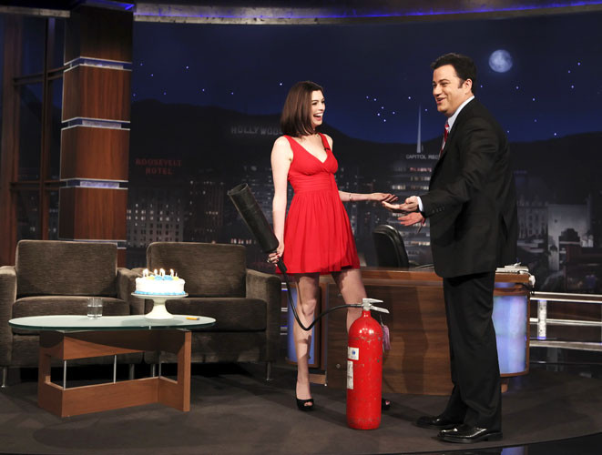 Anne Hathaway showing her legs in red mini skirt #75404987