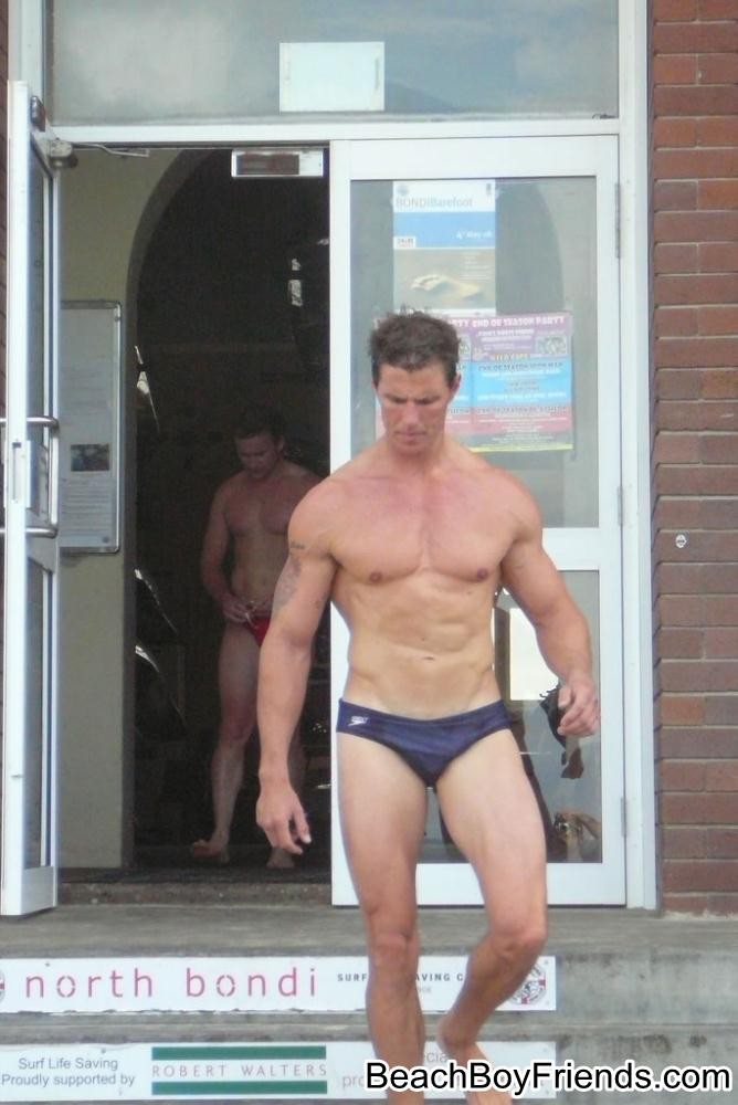 Big muscled dudes are wearing tight trunks at the beach #76945101