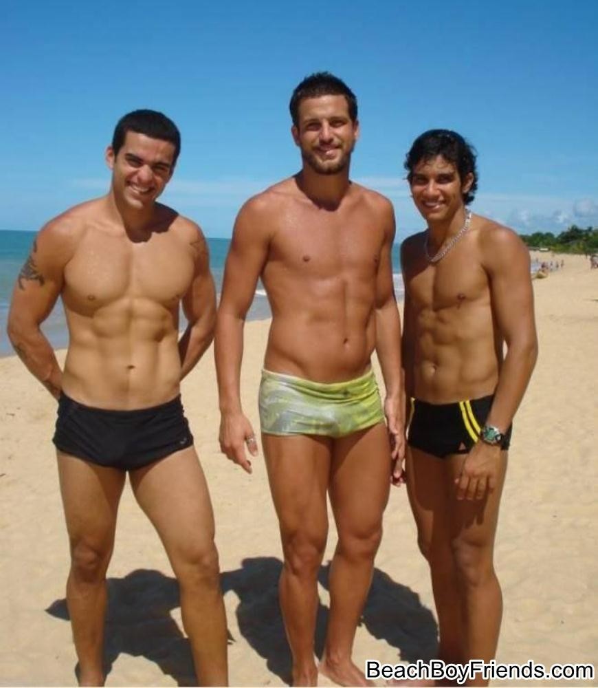 Big muscled dudes are wearing tight trunks at the beach #76945109